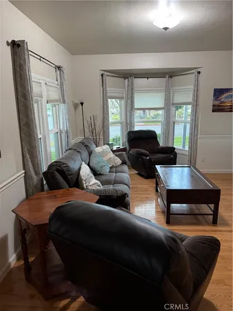 a bathroom with a sink a toilet a mirror and shower