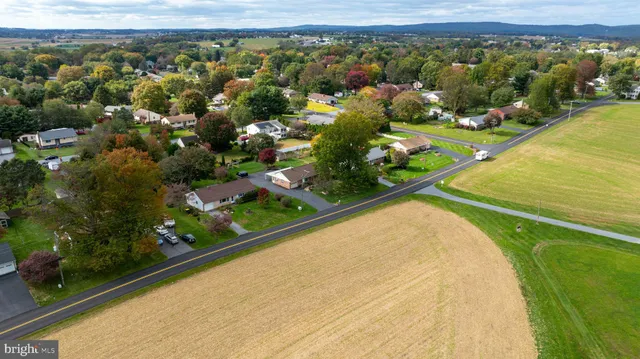 an aerial view of a house with a lake view