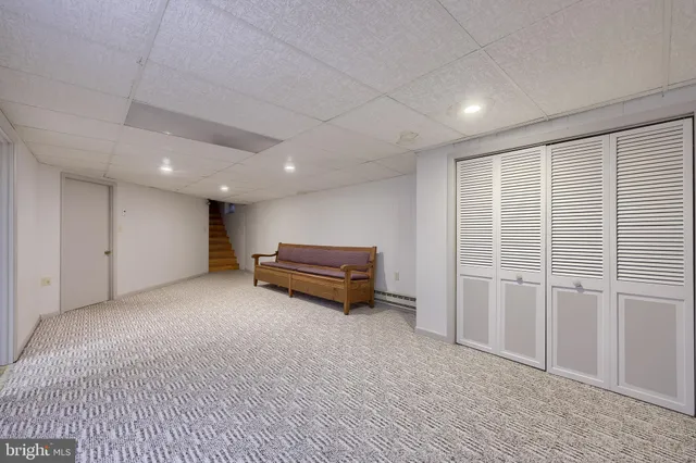 a view of a hall with wooden floor