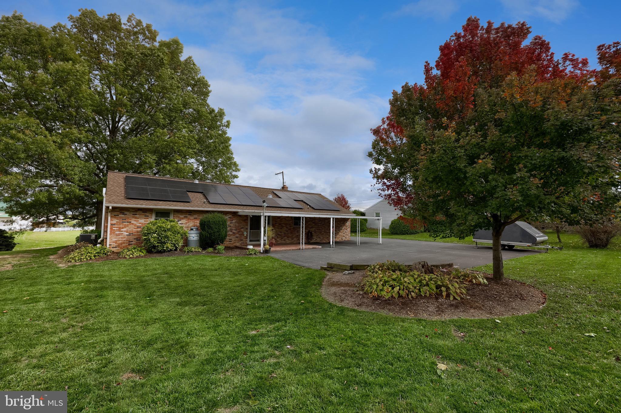 810 Snyder Hill Road Lititz, PA 17543 - Photo 55 of 62 a front view of a house with a garden