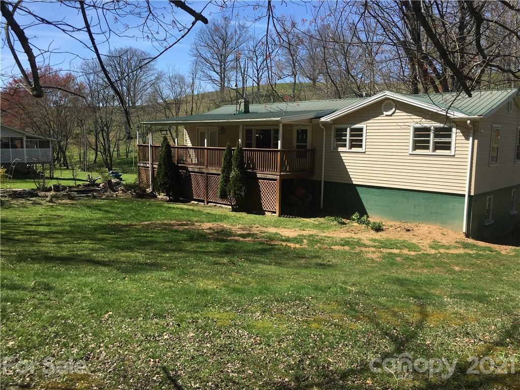 289 Long Branch Road Clyde, NC 28721 - Photo 2 of 44 a view of a house with a yard