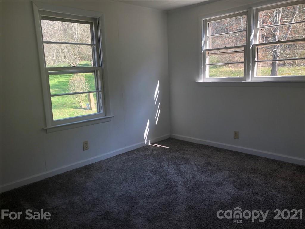 289 Long Branch Road Clyde, NC 28721 - Photo 16 of 44 an empty room with a window