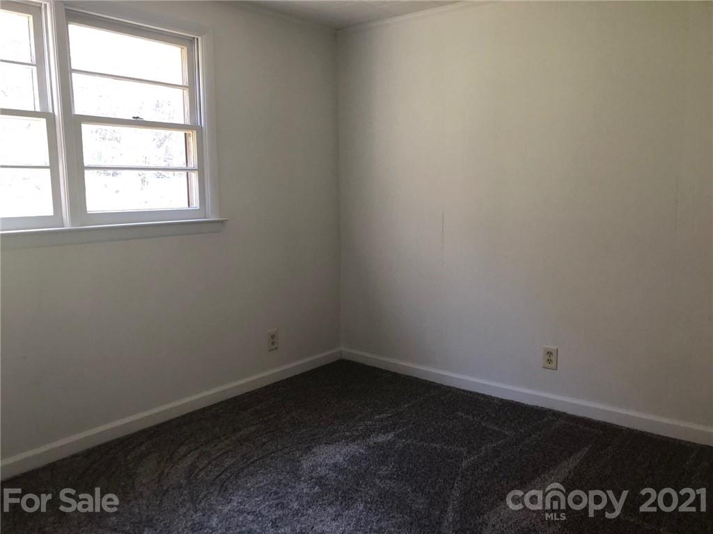 289 Long Branch Road Clyde, NC 28721 - Photo 17 of 44 an empty room with a window