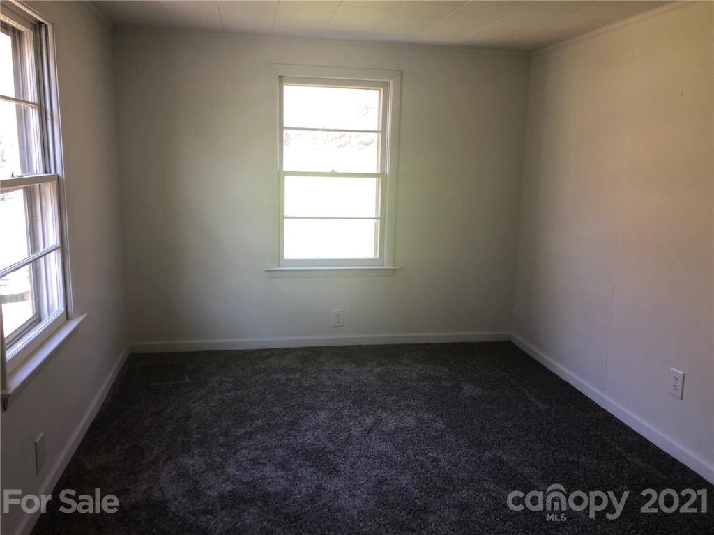289 Long Branch Road Clyde, NC 28721 - Photo 18 of 44 an empty room with a window