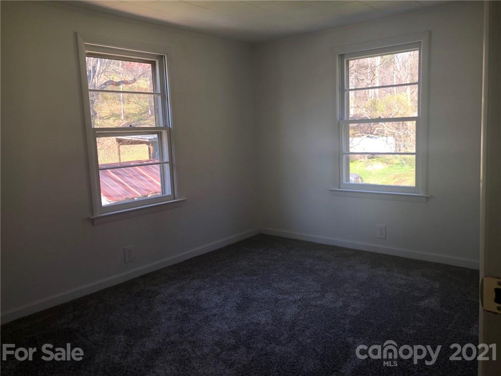 289 Long Branch Road Clyde, NC 28721 - Photo 19 of 44 an empty room with a window