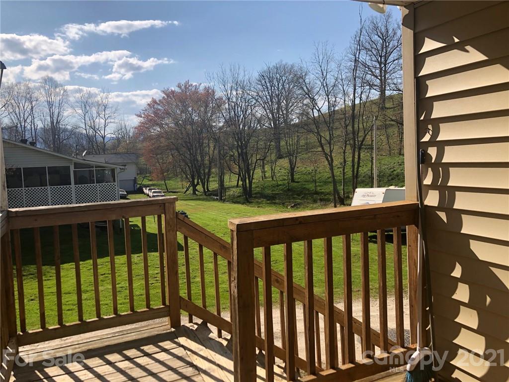 289 Long Branch Road Clyde, NC 28721 - Photo 23 of 44 a view of a wooden deck
