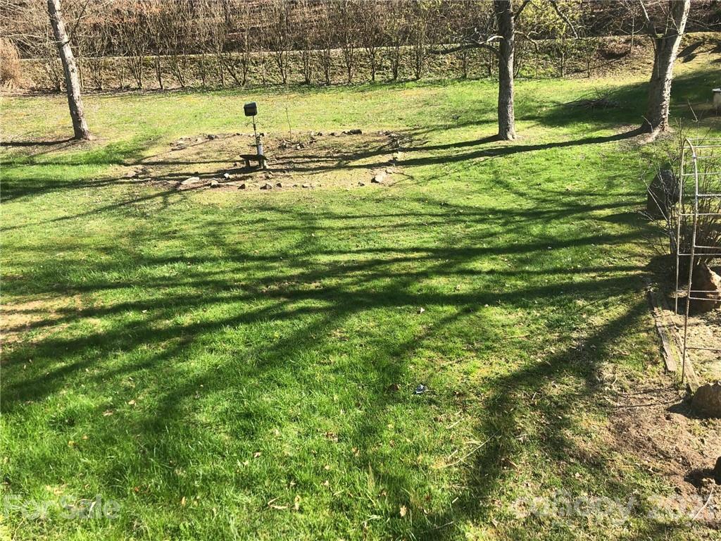 289 Long Branch Road Clyde, NC 28721 - Photo 25 of 44 a view of a yard with an outdoor space