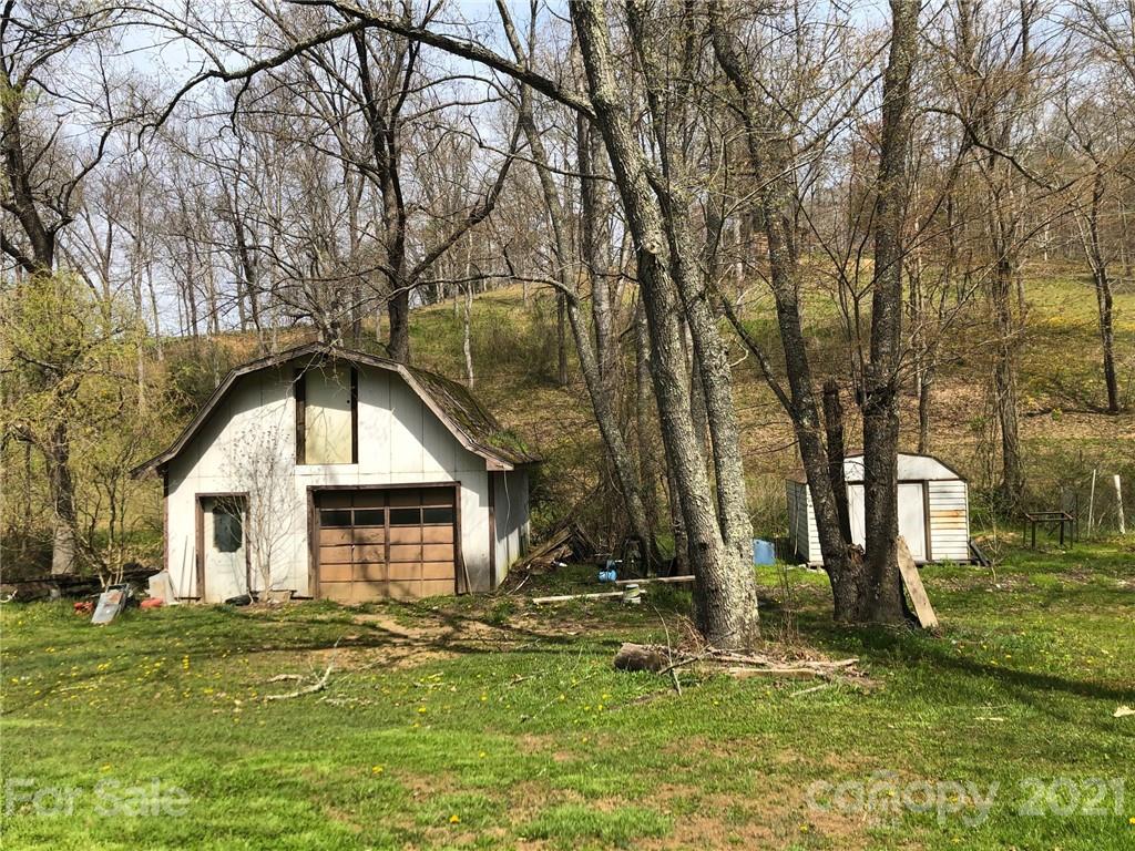 289 Long Branch Road Clyde, NC 28721 - Photo 30 of 44 a backyard of a house with lots of green space