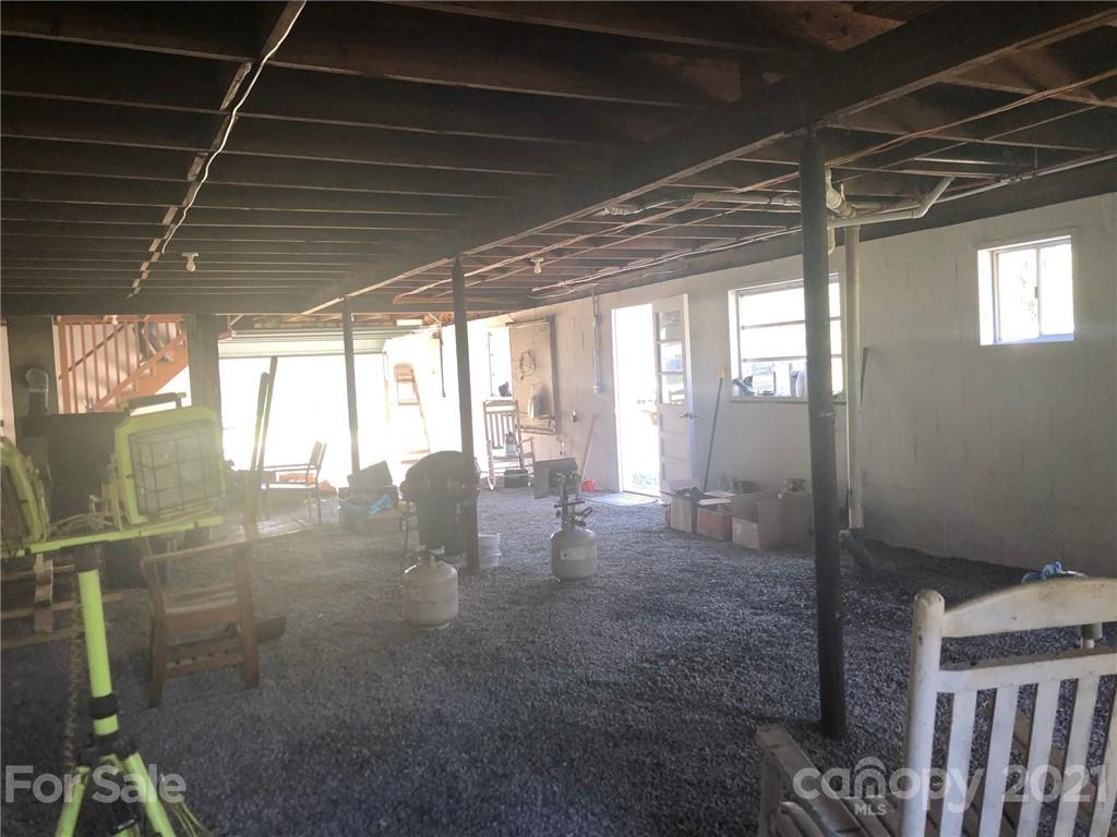 289 Long Branch Road Clyde, NC 28721 - Photo 43 of 44 a room with lots of windows and door