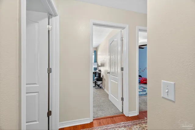 a view of a bathroom from a hallway
