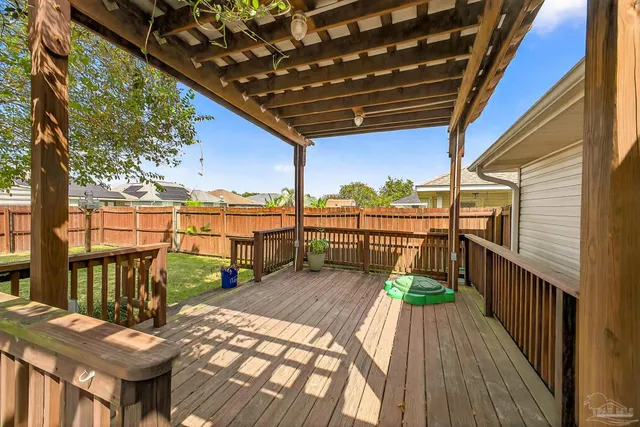 a view of a balcony with wooden floor