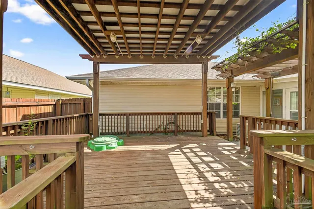 a view of a porch with wooden floor