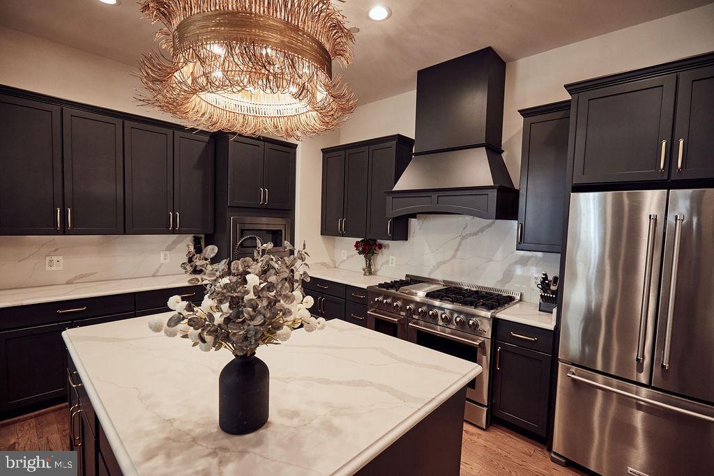 6306 Canter Way, Unit 13 Baltimore, MD 21212 - Photo 11 of 63 a kitchen with stainless steel appliances granite countertop a sink stove and refrigerator