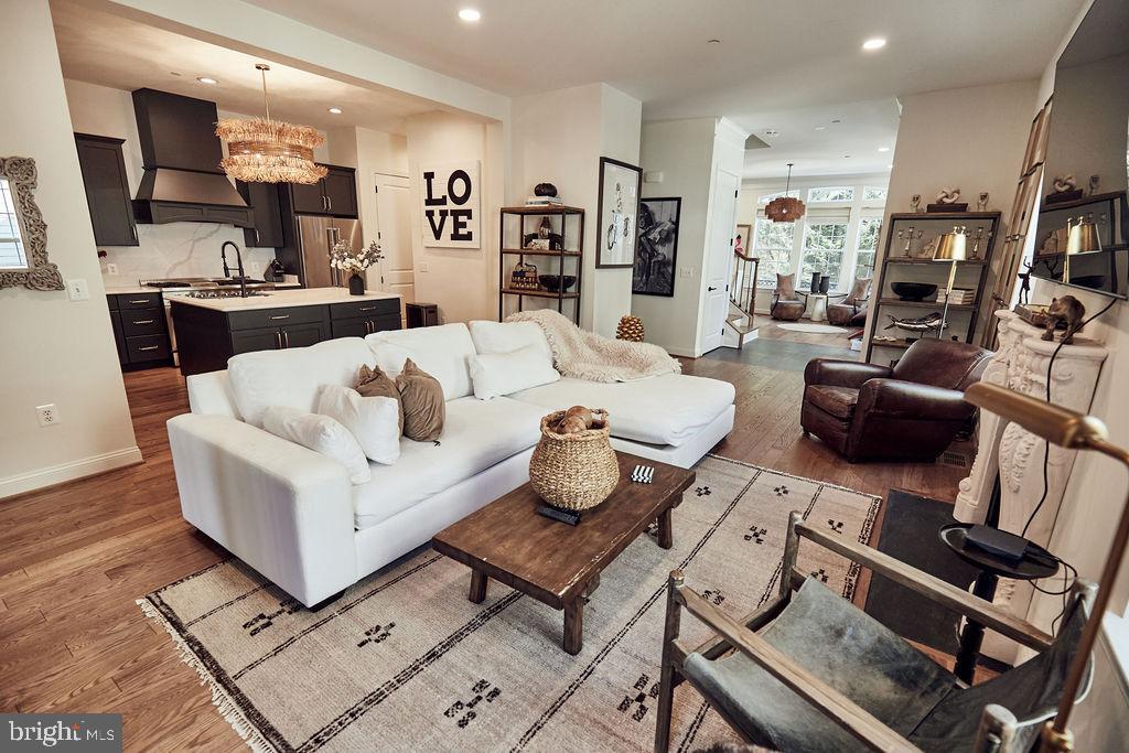 6306 Canter Way, Unit 13 Baltimore, MD 21212 - Photo 12 of 63 a living room with furniture and a flat screen tv