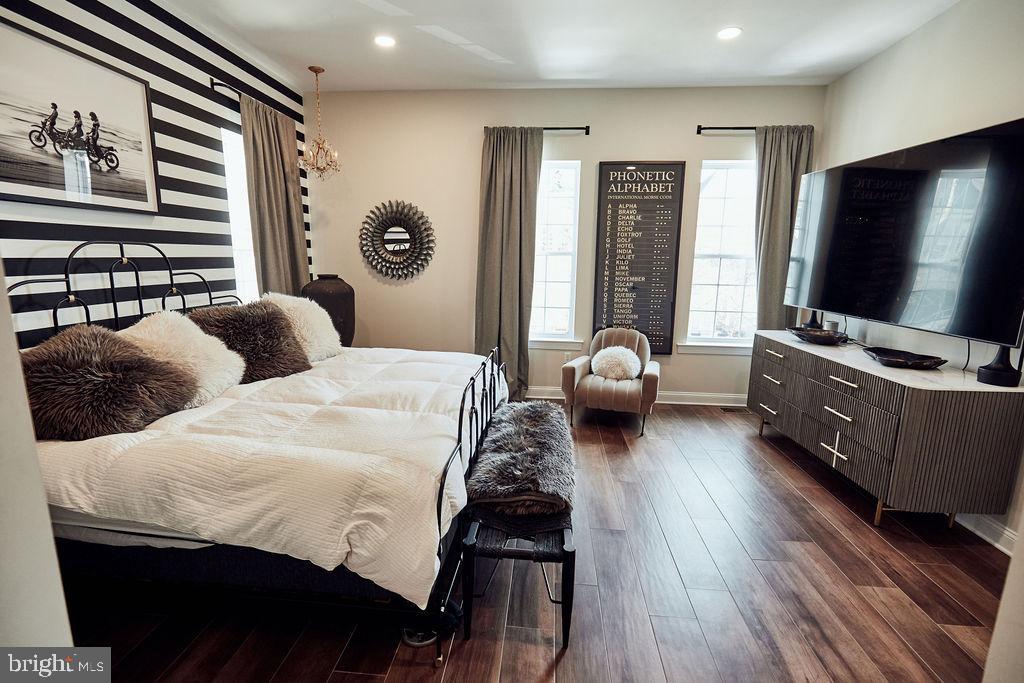 6306 Canter Way, Unit 13 Baltimore, MD 21212 - Photo 18 of 63 a bedroom with a bed and a flat tv screen on dresser