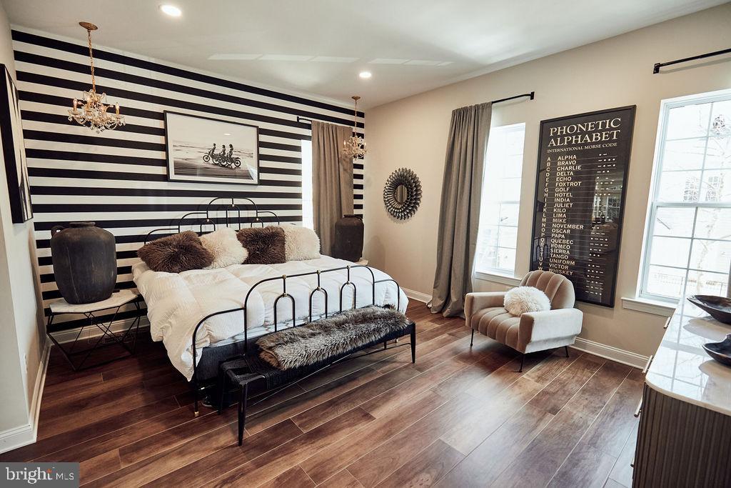 6306 Canter Way, Unit 13 Baltimore, MD 21212 - Photo 19 of 63 a bedroom with a bed and wooden floor