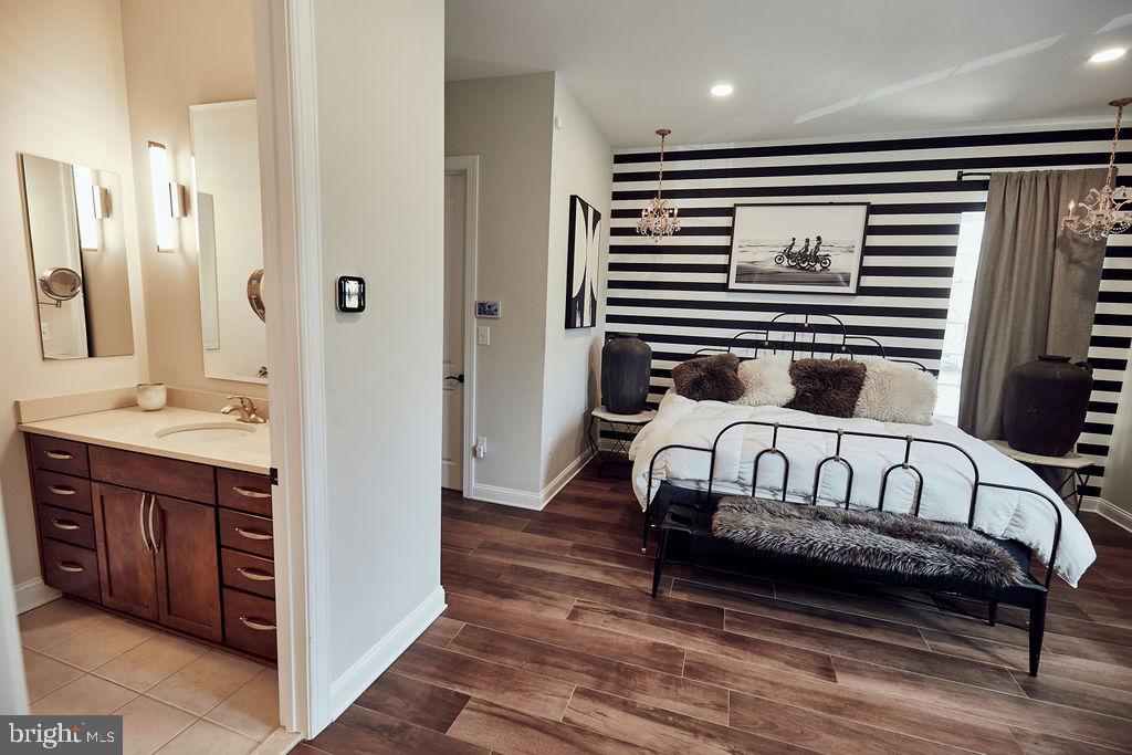 6306 Canter Way, Unit 13 Baltimore, MD 21212 - Photo 21 of 63 a en suite bathroom with a sink and a mirror