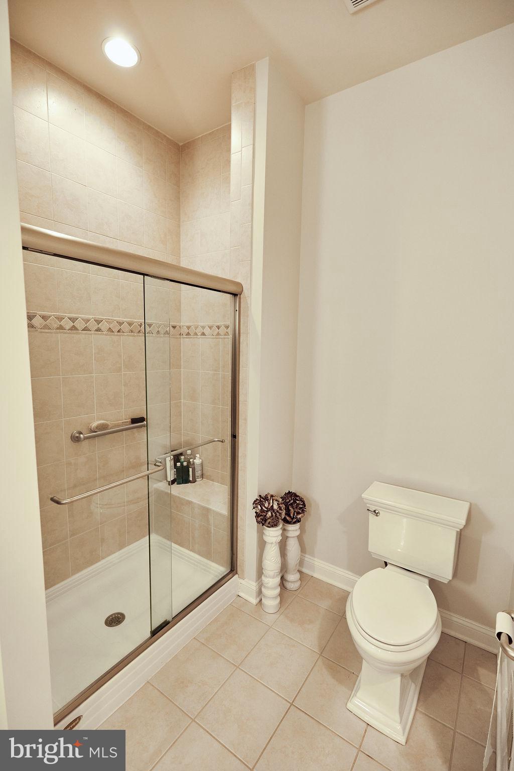 6306 Canter Way, Unit 13 Baltimore, MD 21212 - Photo 23 of 63 a bathroom with a toilet and a shower