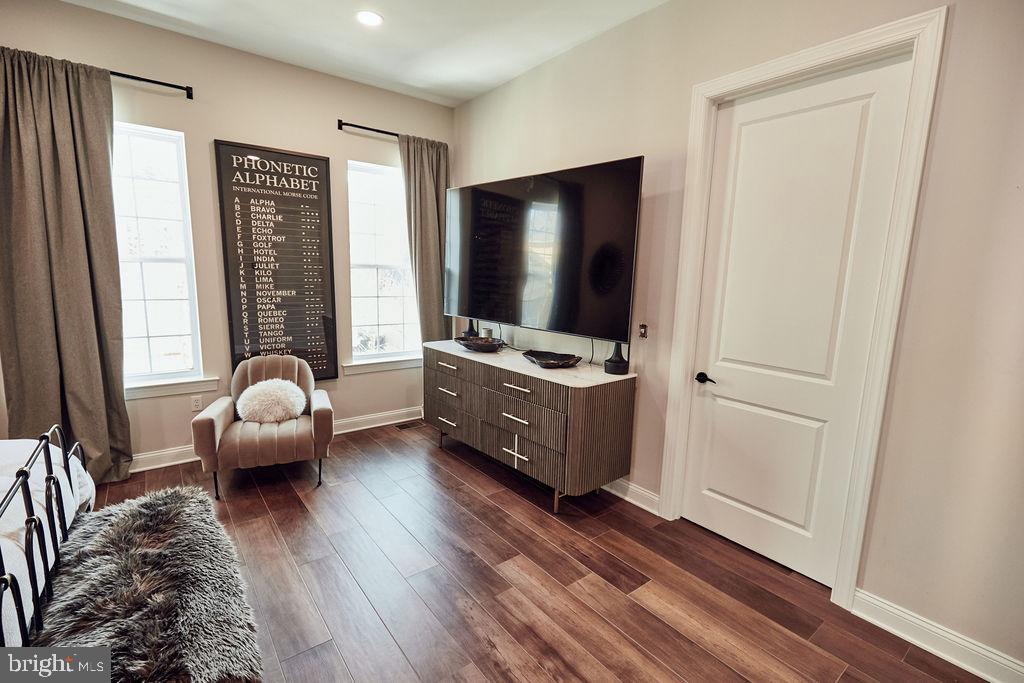 6306 Canter Way, Unit 13 Baltimore, MD 21212 - Photo 27 of 63 a living room with furniture and a flat screen tv