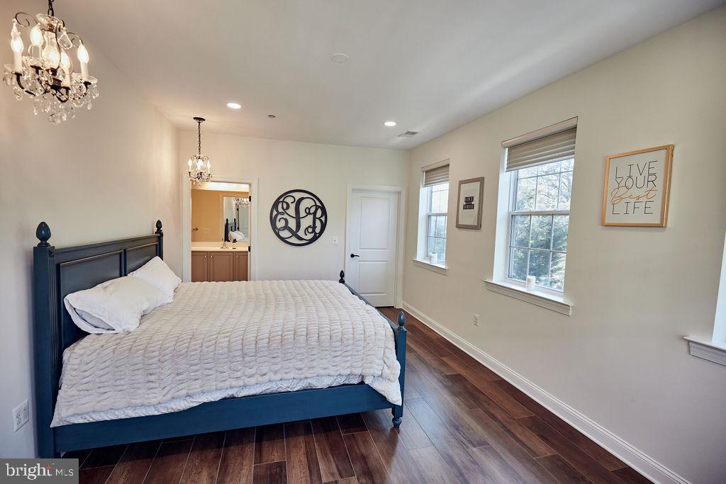 6306 Canter Way, Unit 13 Baltimore, MD 21212 - Photo 29 of 63 a bedroom with a large bed and a window