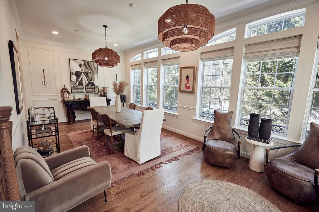 6306 Canter Way, Unit 13 Baltimore, MD 21212 - Photo 3 of 63 a living room with furniture a chandelier and a large window