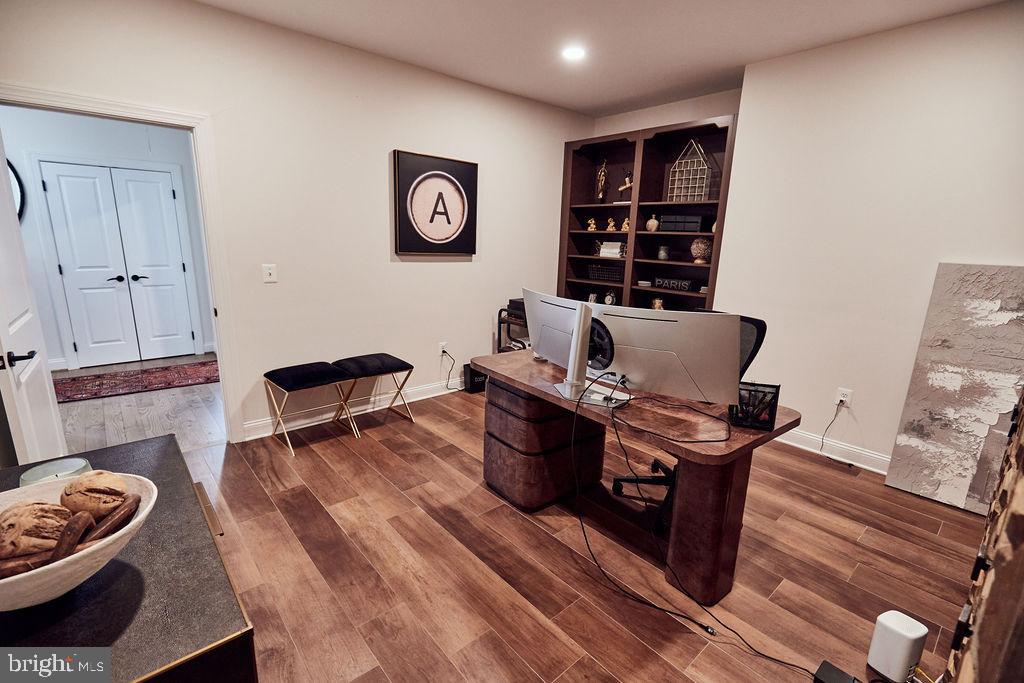 6306 Canter Way, Unit 13 Baltimore, MD 21212 - Photo 42 of 63 a living room with furniture and wooden floor