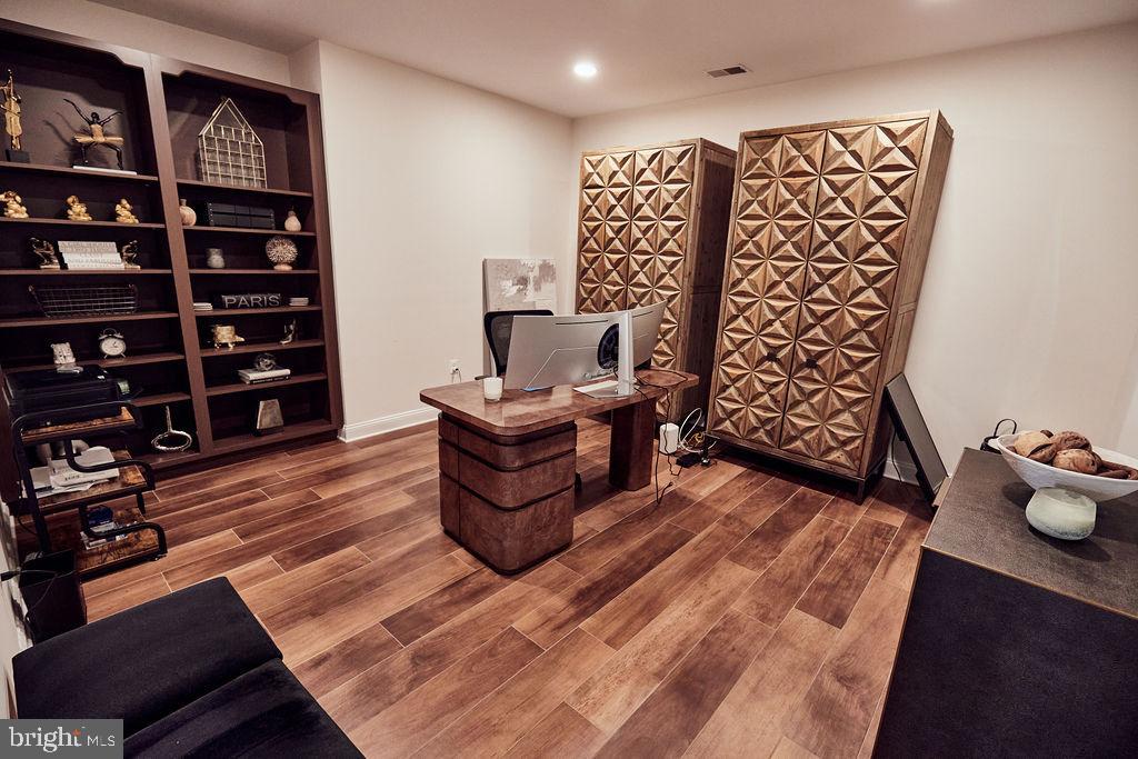 6306 Canter Way, Unit 13 Baltimore, MD 21212 - Photo 43 of 63 a view of a room with racks on the wall