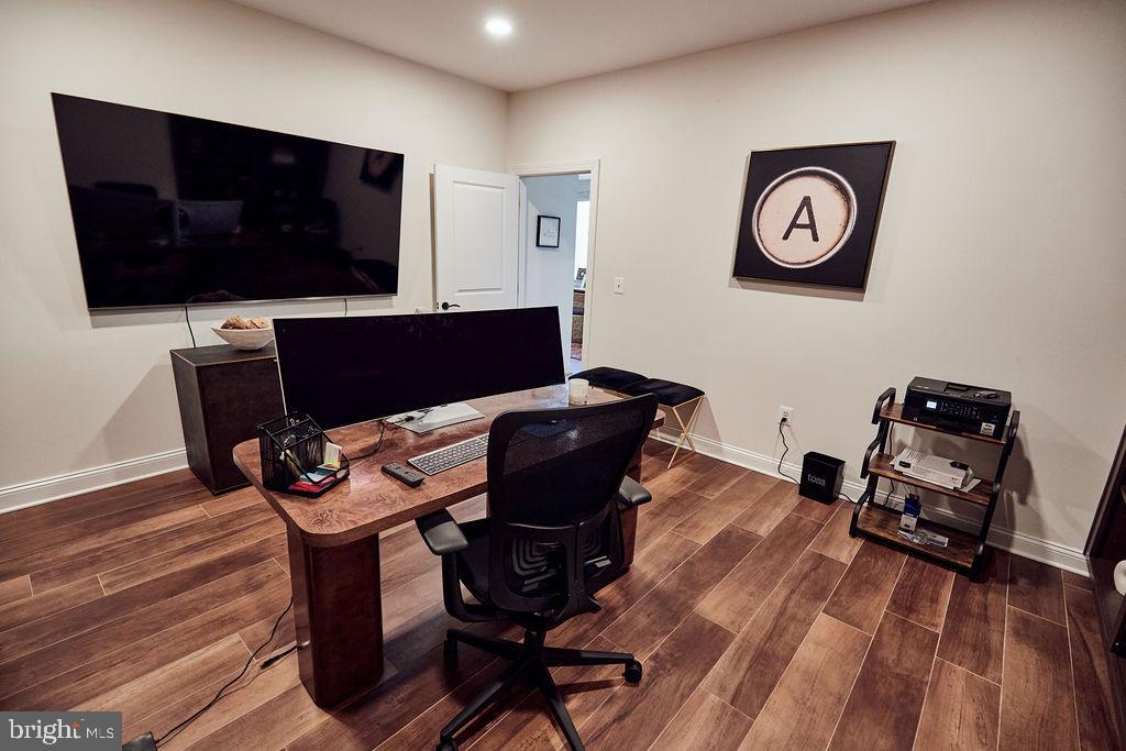 6306 Canter Way, Unit 13 Baltimore, MD 21212 - Photo 44 of 63 a view of a workspace with furniture and wooden floor