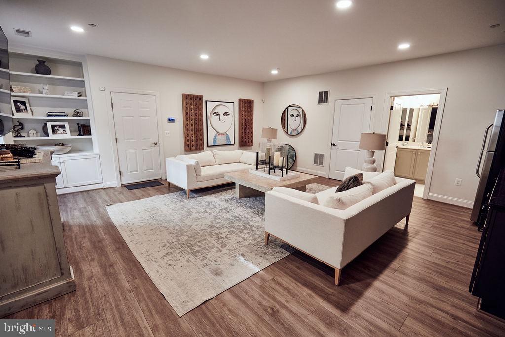 6306 Canter Way, Unit 13 Baltimore, MD 21212 - Photo 45 of 63 a living room with furniture and a table