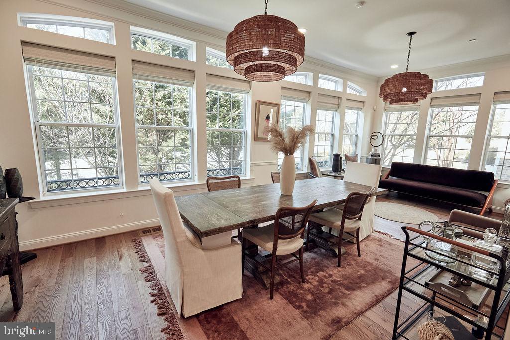 6306 Canter Way, Unit 13 Baltimore, MD 21212 - Photo 5 of 63 a view of a dining room with furniture wooden floor and chandelier
