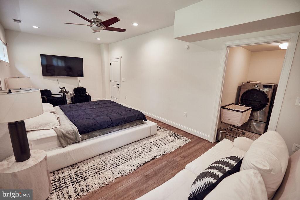 6306 Canter Way, Unit 13 Baltimore, MD 21212 - Photo 51 of 63 a living room with furniture and a flat screen tv