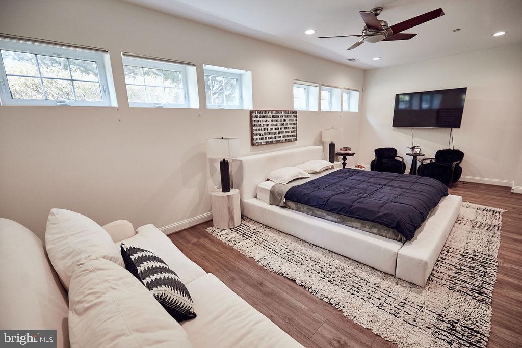 6306 Canter Way, Unit 13 Baltimore, MD 21212 - Photo 53 of 63 a living room with a couch and a flat screen tv