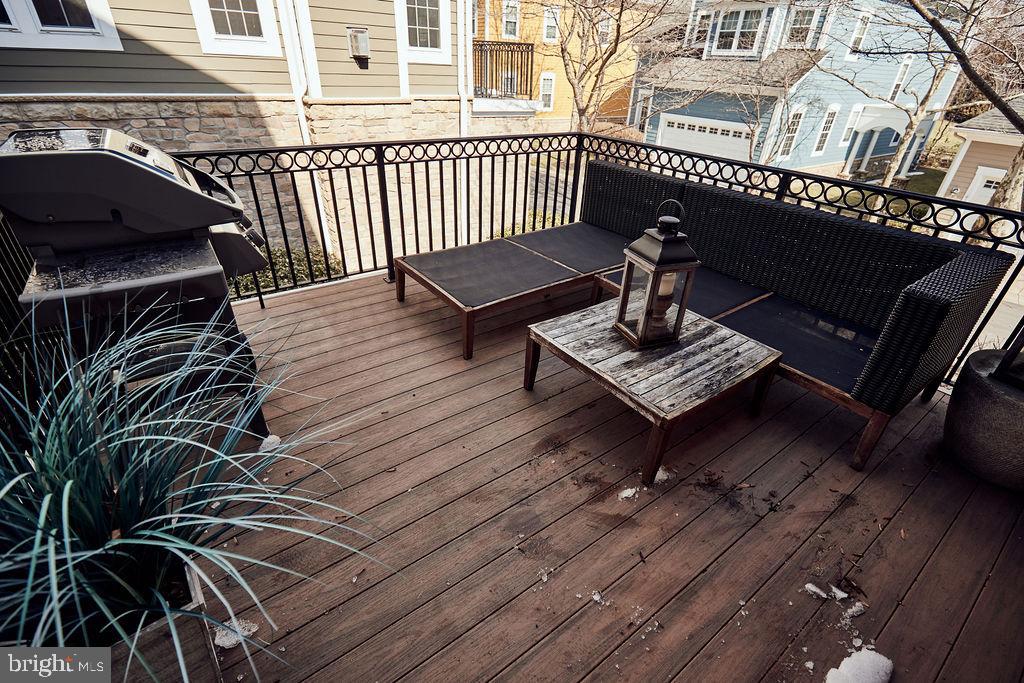 6306 Canter Way, Unit 13 Baltimore, MD 21212 - Photo 57 of 63 a view of a roof deck with wooden floor and fence