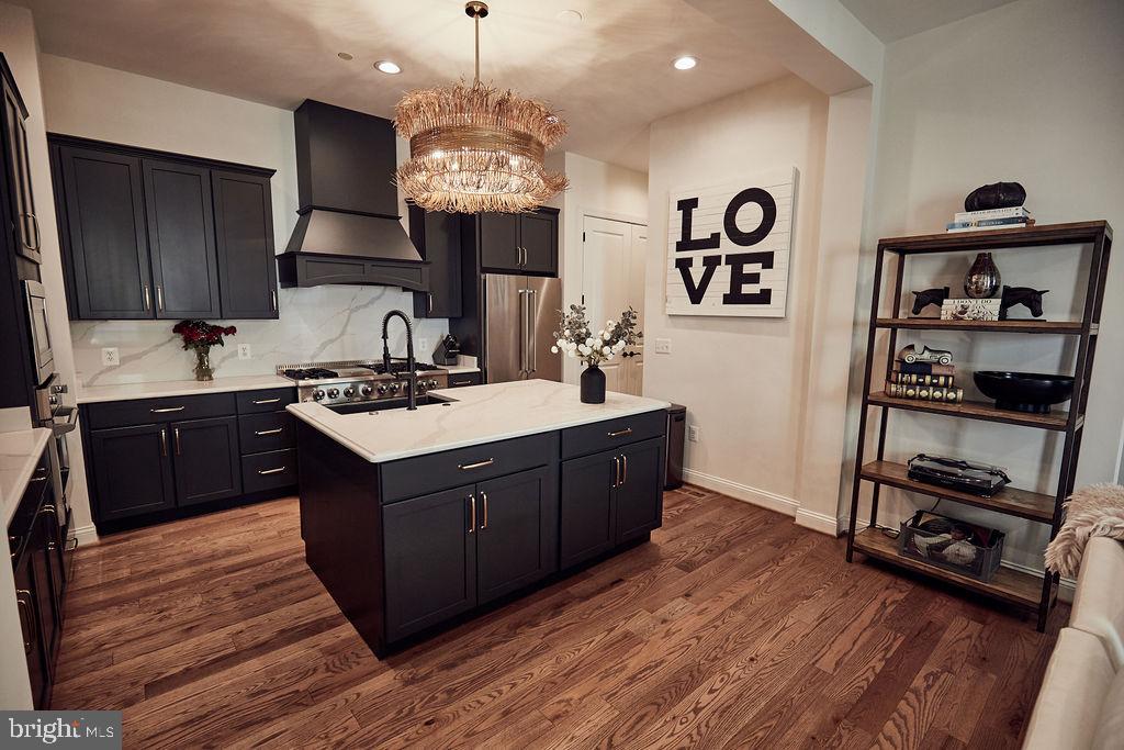 6306 Canter Way, Unit 13 Baltimore, MD 21212 - Photo 7 of 63 a kitchen with a sink and a stove top oven