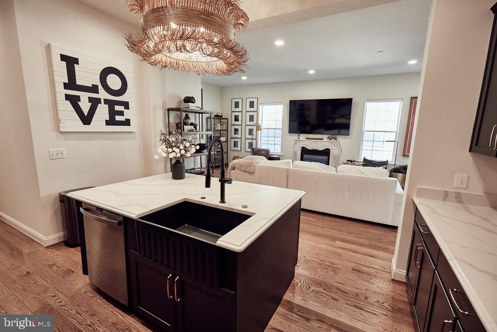 6306 Canter Way, Unit 13 Baltimore, MD 21212 - Photo 8 of 63 a living room with furniture and a flat screen tv