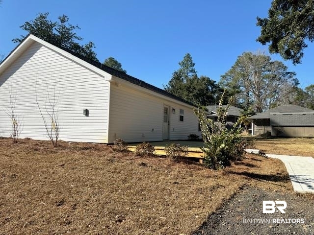 403 East 4th Street Bay Minette, AL 36507 - Photo 4 of 19 View of home's exterior with a lawn