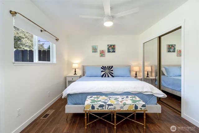 a bedroom with a bed and a table in it