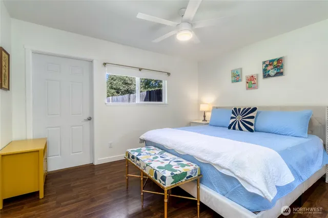 a bedroom with a bed and a table in it