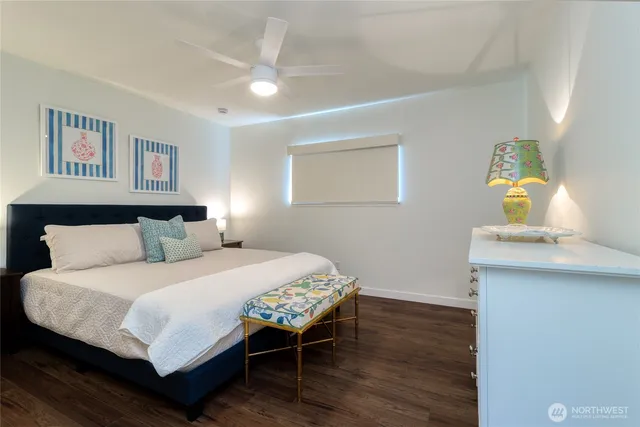 a bedroom with a bed and a dresser