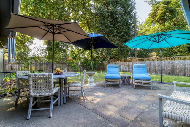 an outdoor space with furniture and umbrella