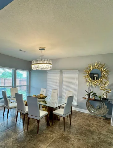 a view of a dining room with furniture