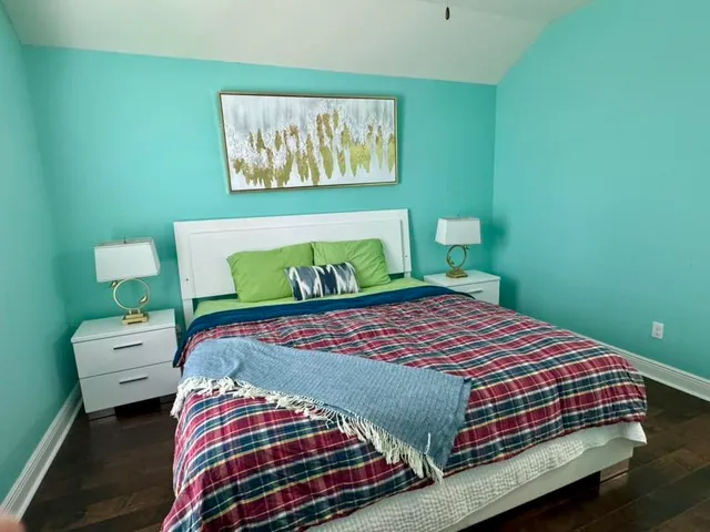 a bedroom with a bed and a dresser