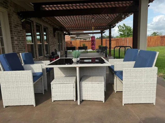 a wooden bench sitting in front of a house