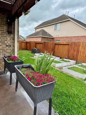 a view of an outdoor sitting area with furniture and wooden floor