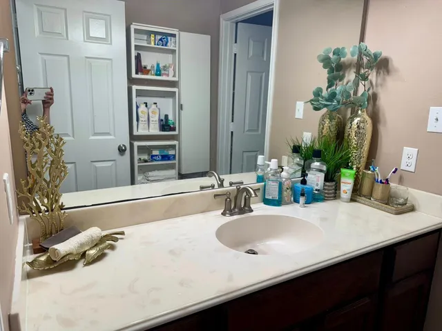 a bathroom with a sink and a mirror