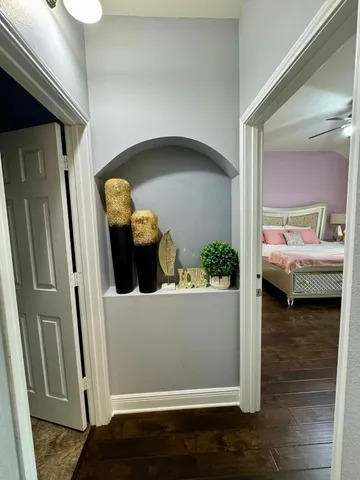 a view of living room and hardwood floor