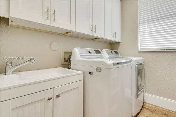 a utility room with dryer and washer