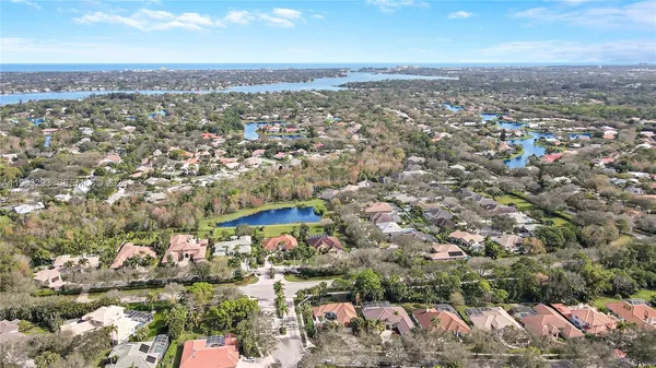 an aerial view of residential building with green space