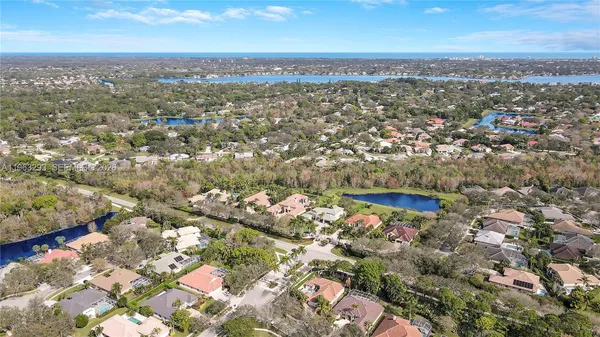 an aerial view of residential building with green space