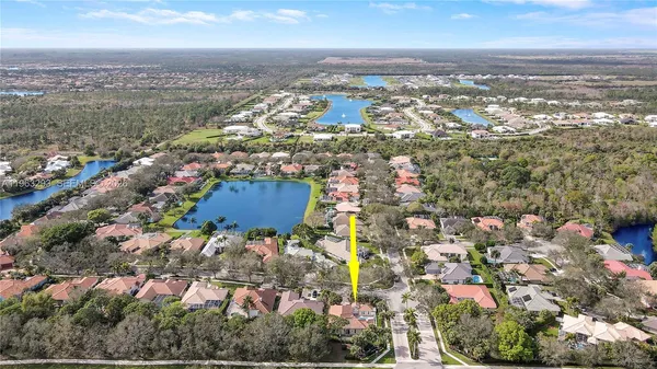 an aerial view of residential building with green space